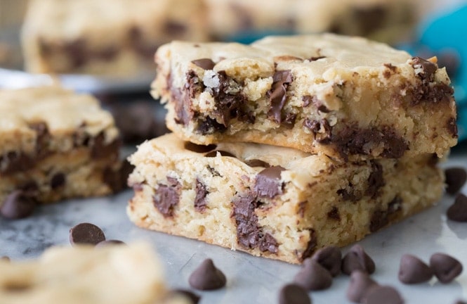 Chewy chocolate chip cookie bars on marble board