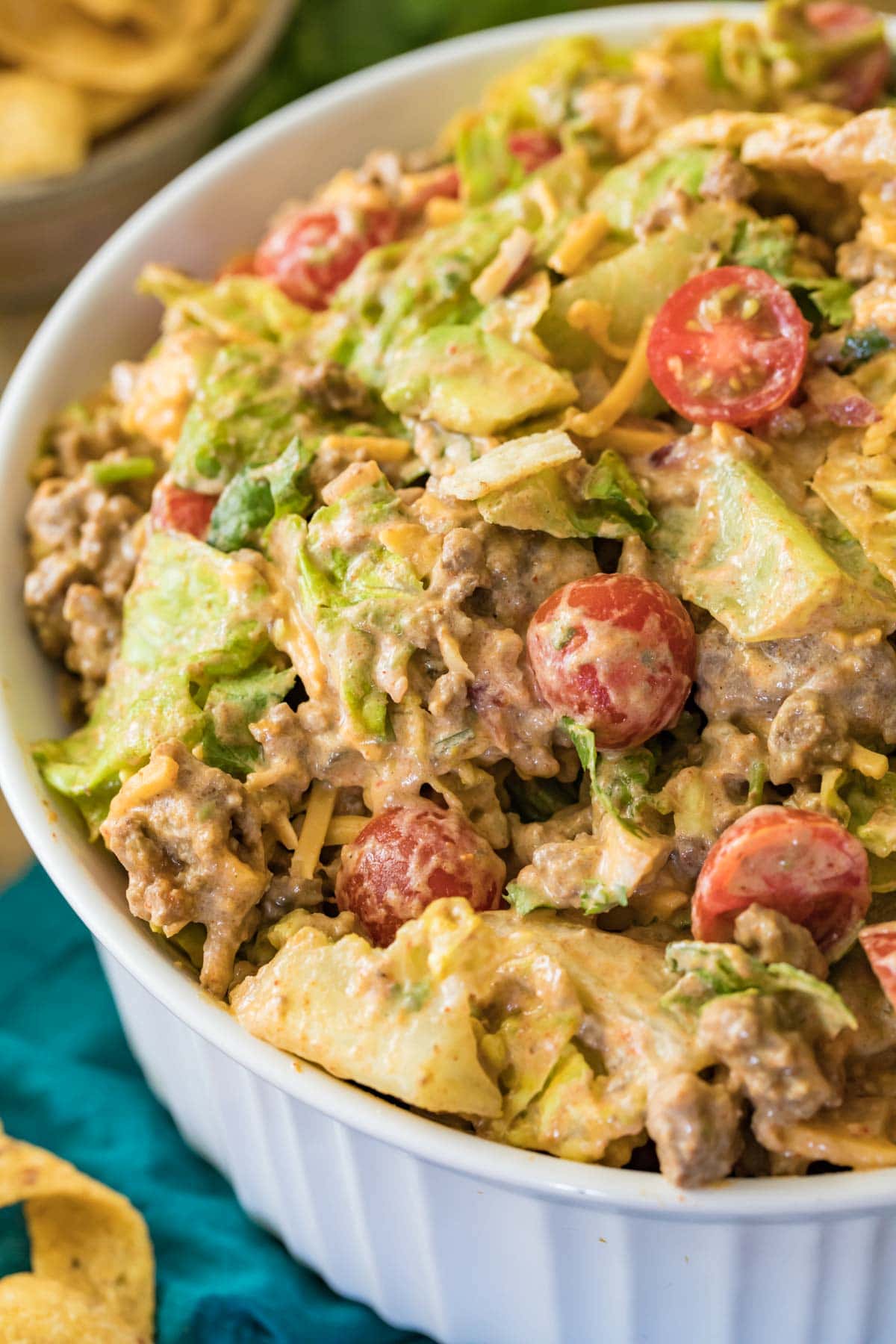 side view of taco salad in white dish