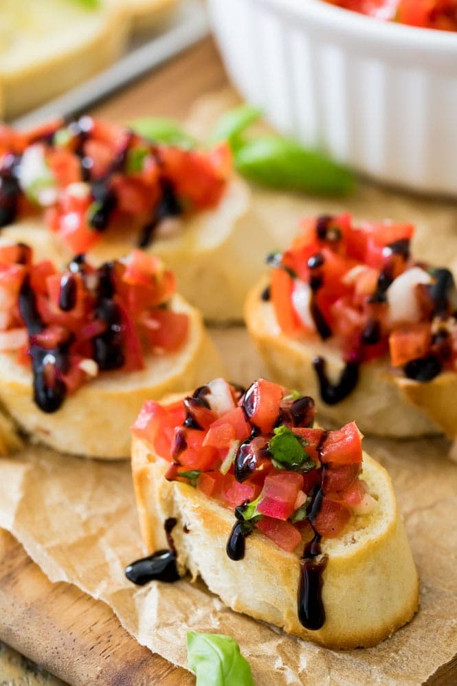 Homemade bruschetta drizzled with balsamic reduction