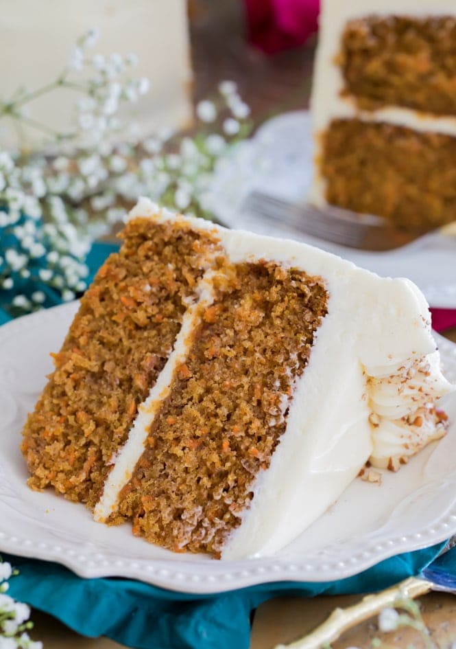 Slice of carrot cake on white plate