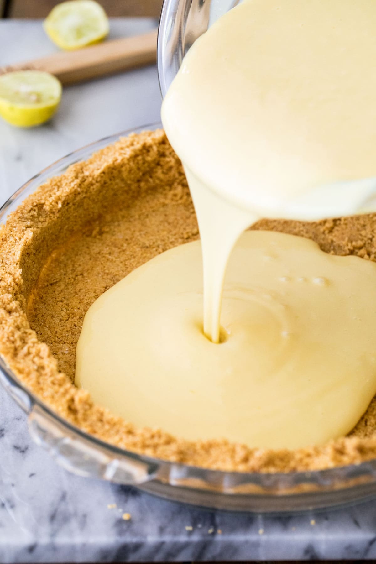 pouring filling into pie crust