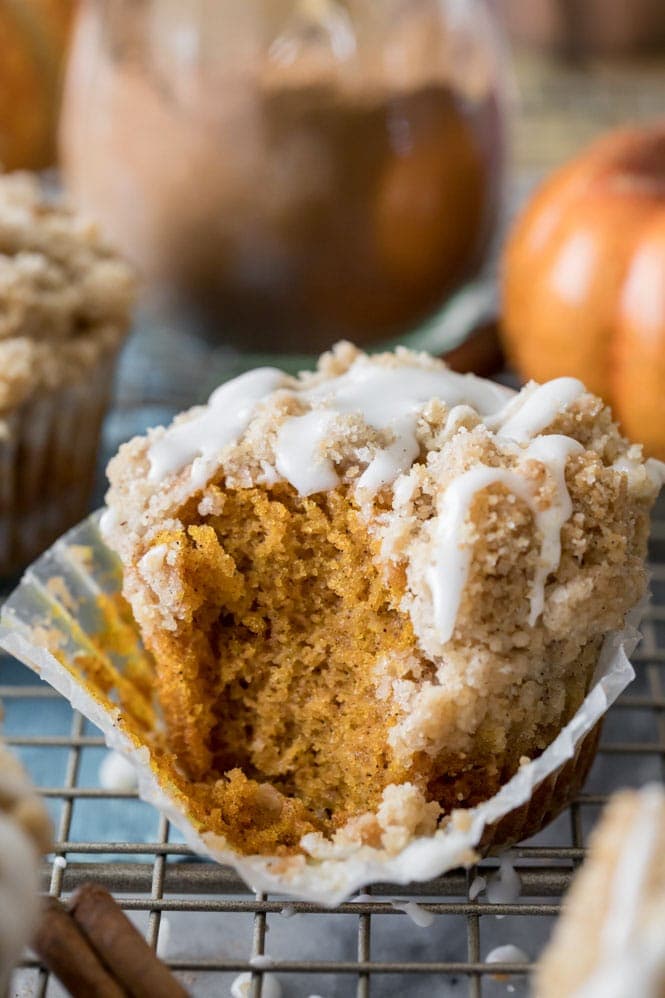 Muffin with bite out of it: Showing the soft fluffy inside of pumpkin muffin