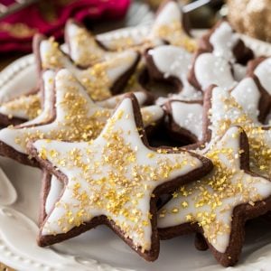 Chocolate sugar cookies in star shape with white icing