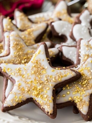 Chocolate sugar cookies in star shape with white icing