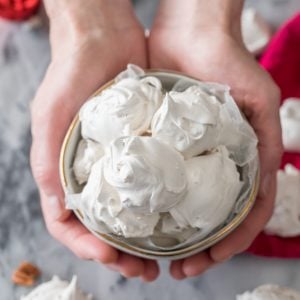 Hands holding seafoam in bowl