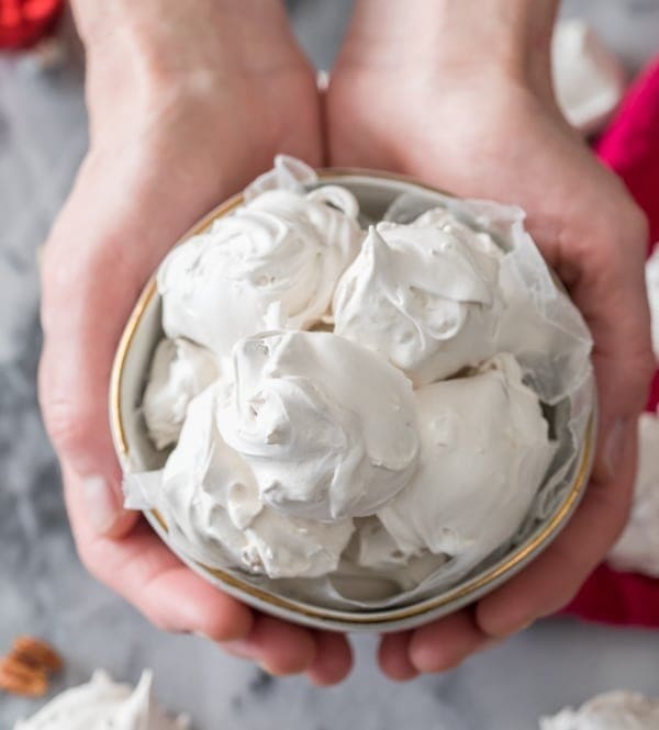 Hands holding seafoam in bowl