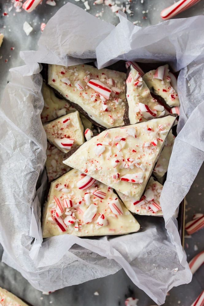 Peppermint Bark pieces in container on marble surface