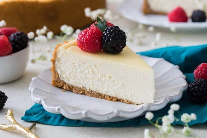 Slice of creamy cheesecake on white plate