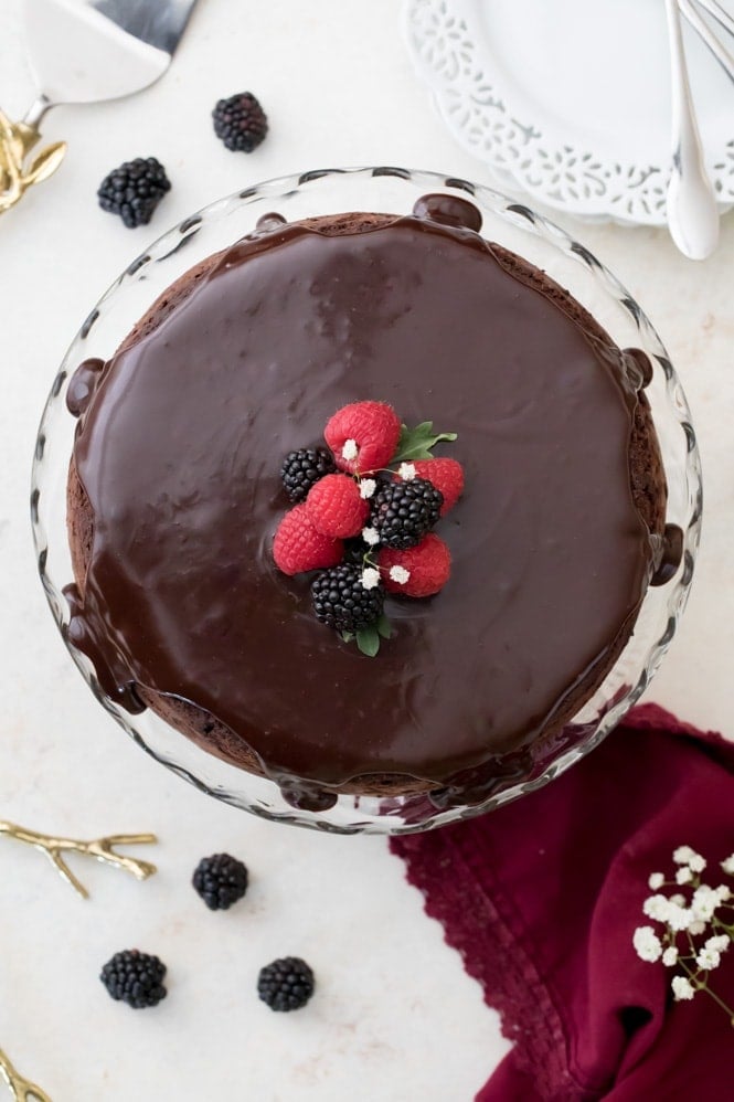Ganache poured over flourless chocolate cake