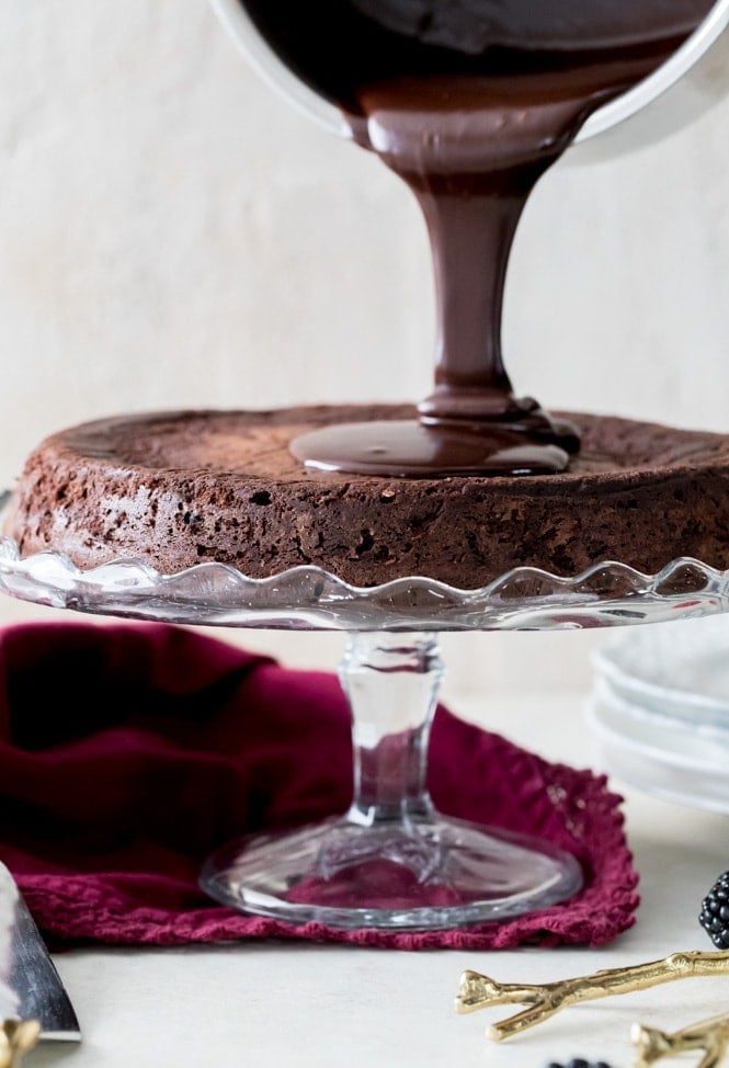 Pouring Ganache over cake