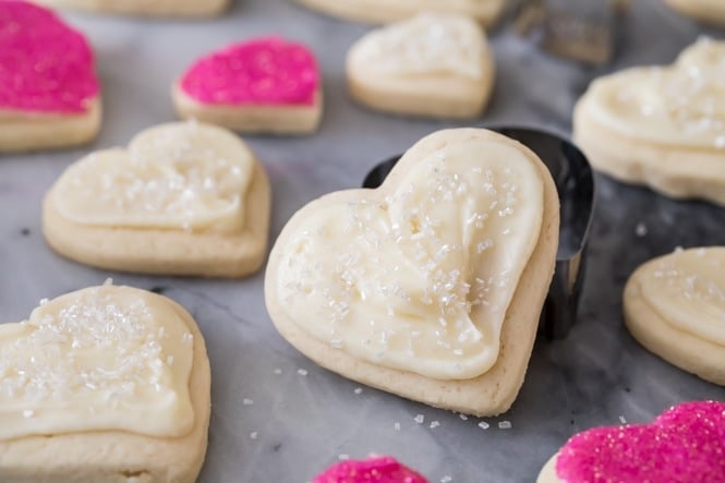 Soft heart shaped cream cheese sugar cookie on cookie cutter