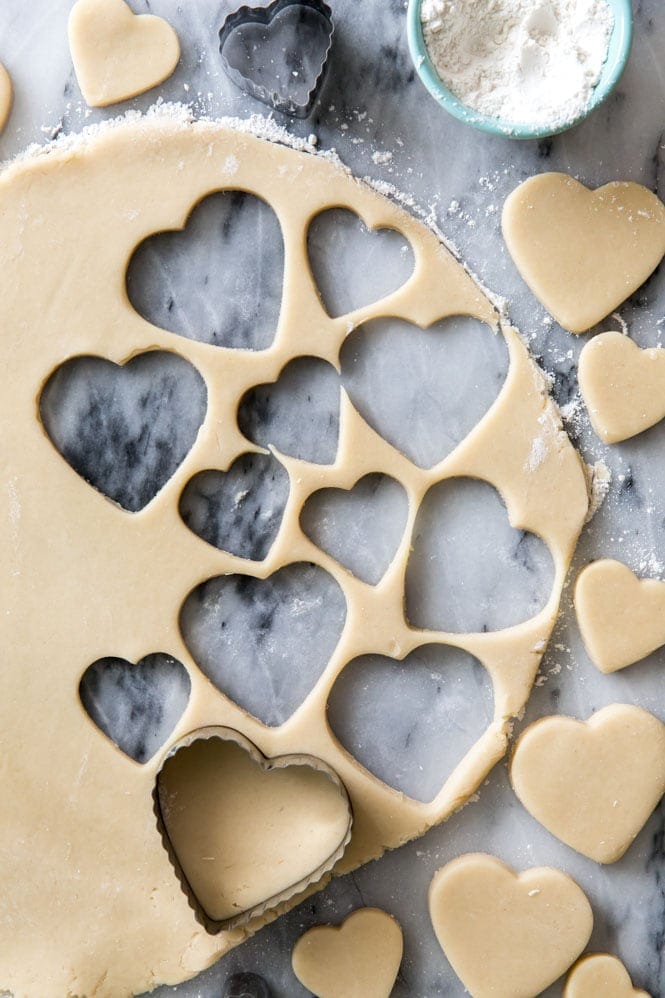 cream cheese sugar cookie dough rolled out and cut into hearts