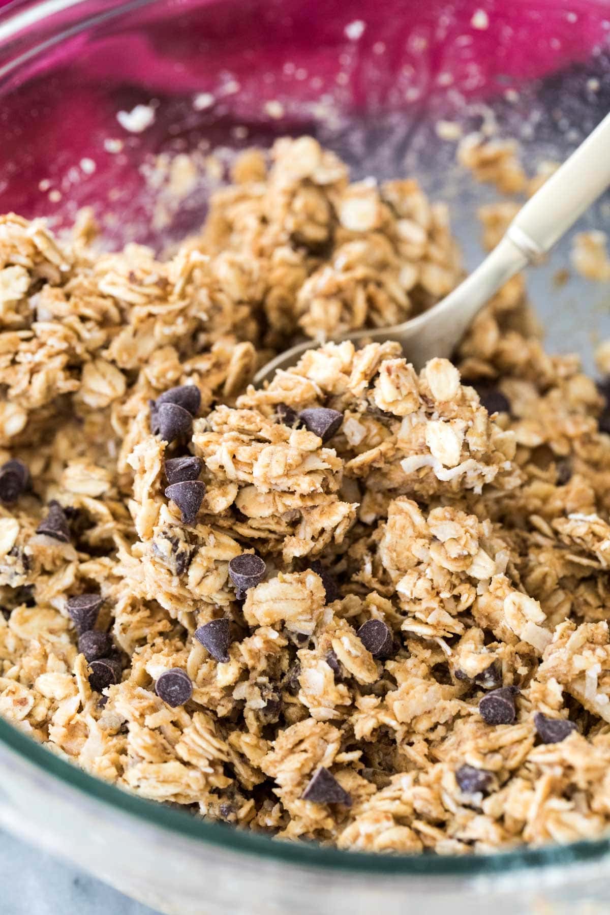 energy bite dough being mixed in glass bowl