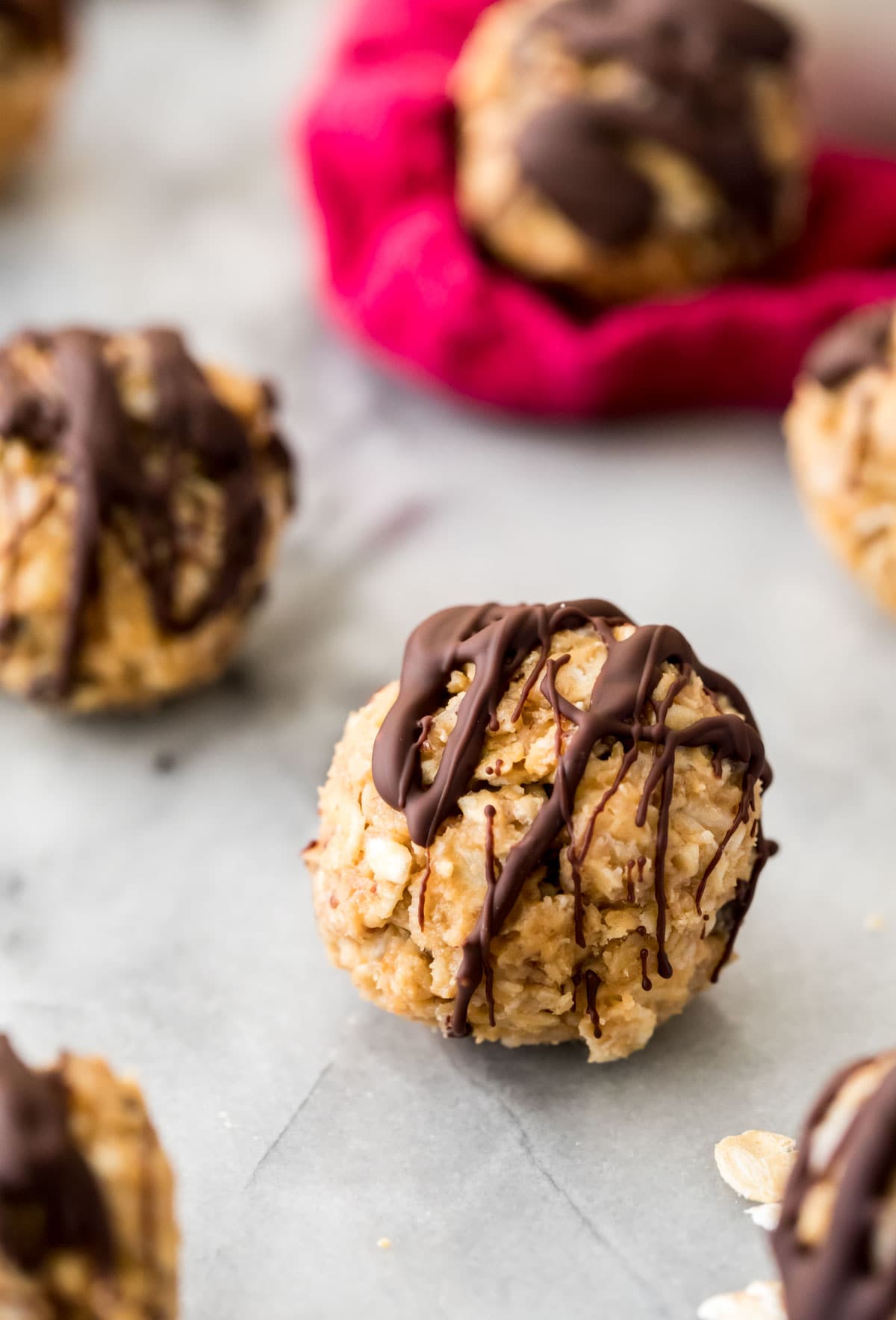 chocolate drizzled energy balls on marble