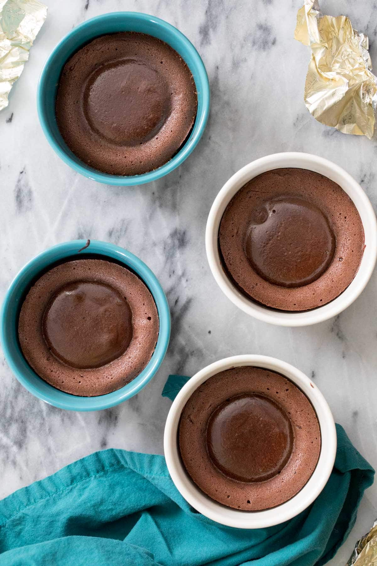 overhead of baked lava cakes in ramekin