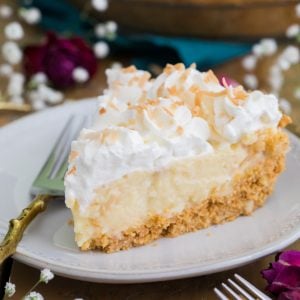 Slice of coconut cream pie on plate