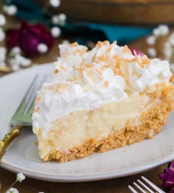 Slice of coconut cream pie on plate