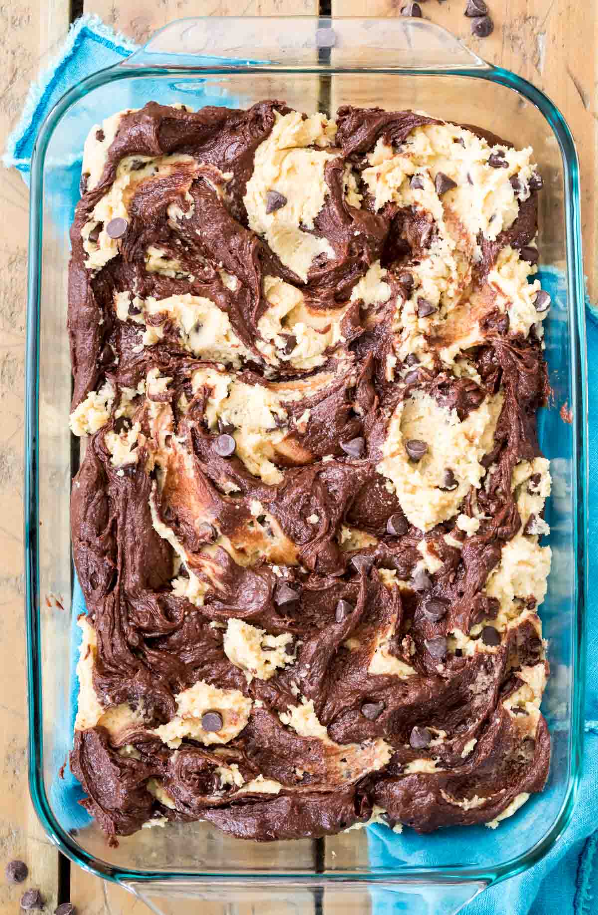 brownie batter and chocolate chip cookie batter swirled together in baking dish