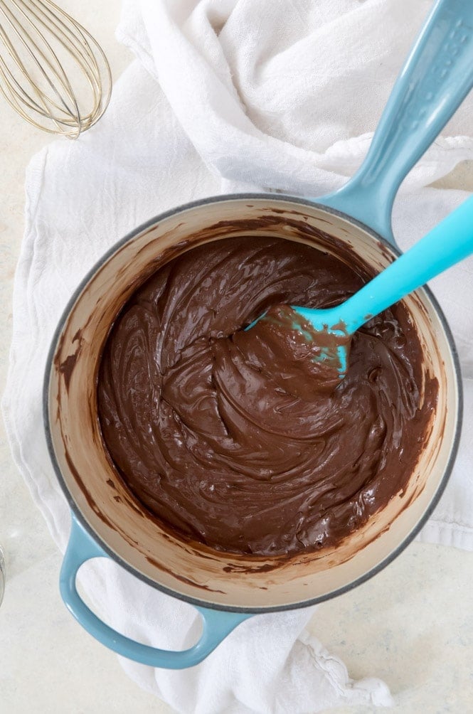 Melting together all ingredients for easy fudge in saucepan