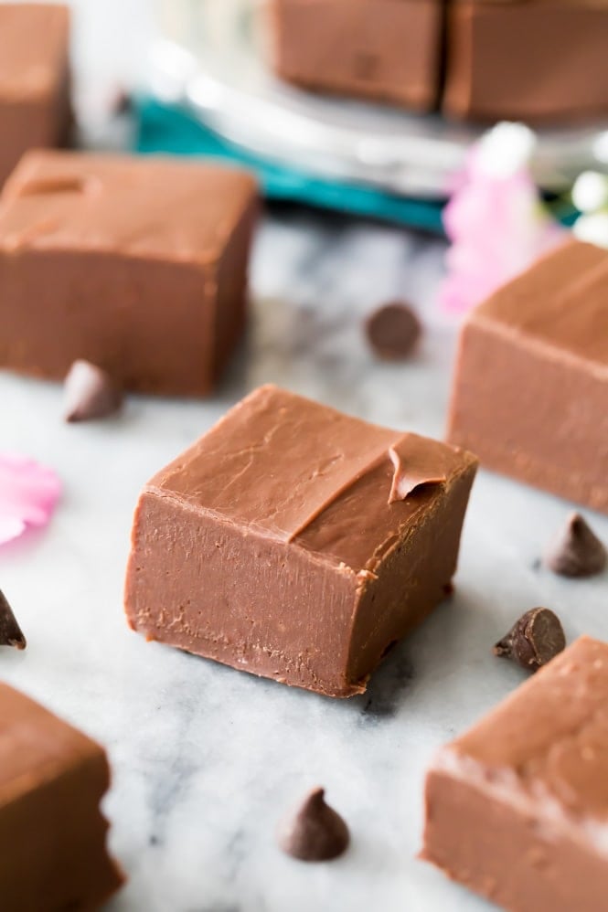 Square of chocolate fudge on marble slab from easy fudge recipe