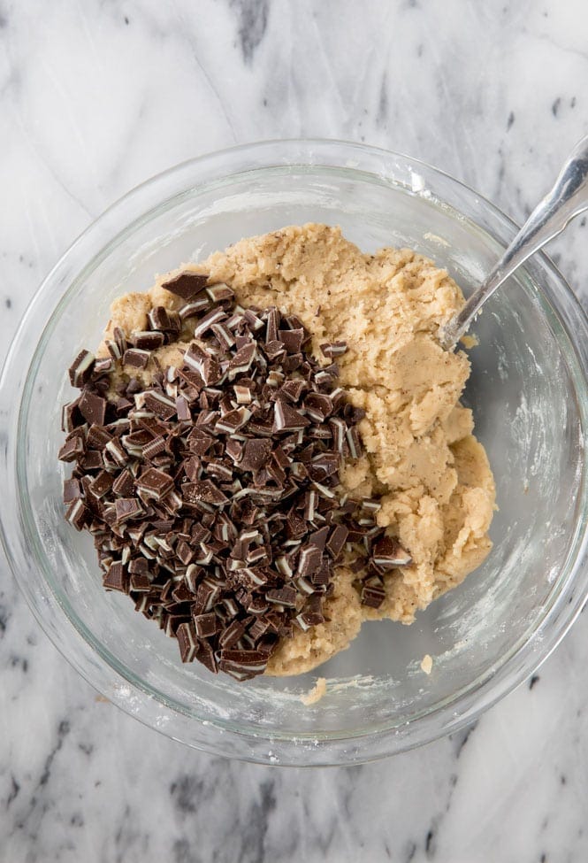 Bowl of mint chocolate chip cookie dough on marble