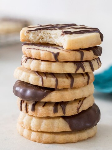 stack of chocolate-drizzled shortbread cookies