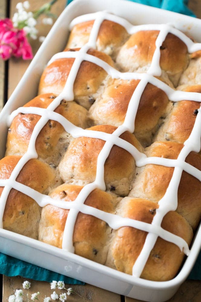 Hot cross buns for easter dessert in white baking dish