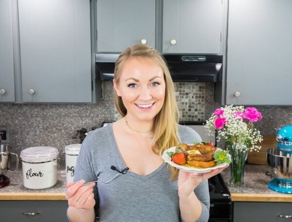 Author (Sam) holding a plate of french toast
