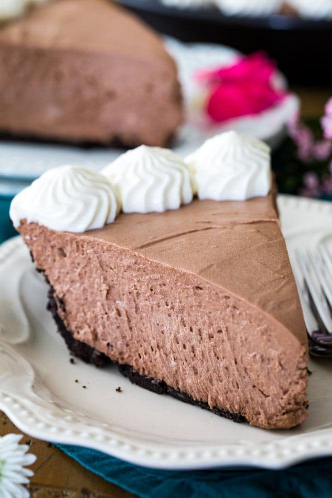 Slice of chocolate icebox pie on white plate