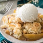 Peach Cobbler with scoop of ice cream, on plate