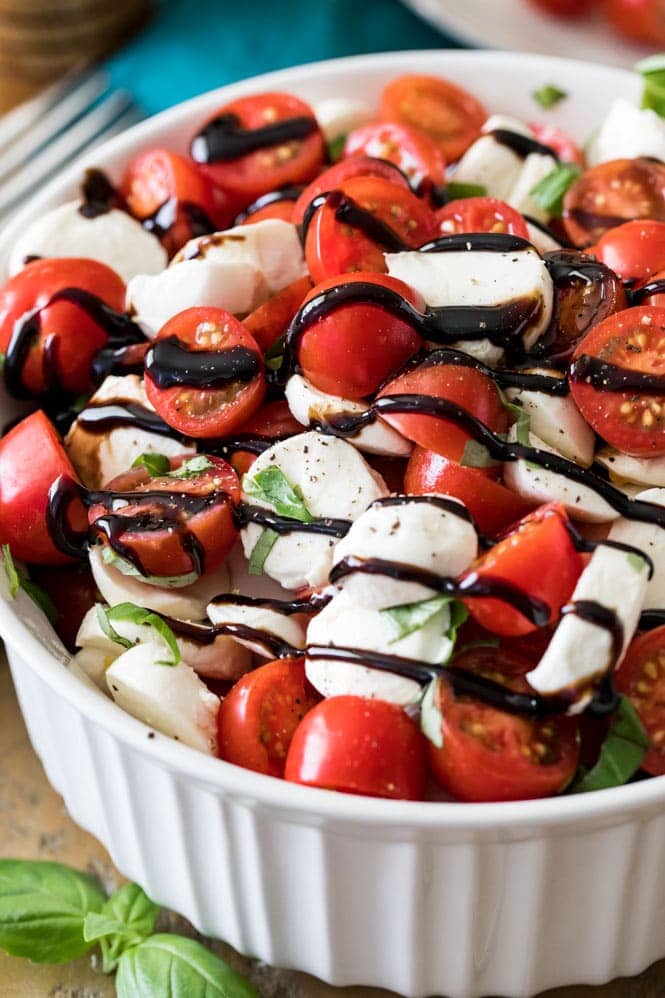 Caprese salad drizzled with balsamic reduction