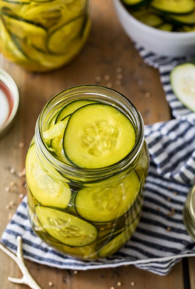 Pickled cucumbers and onions in glass jar