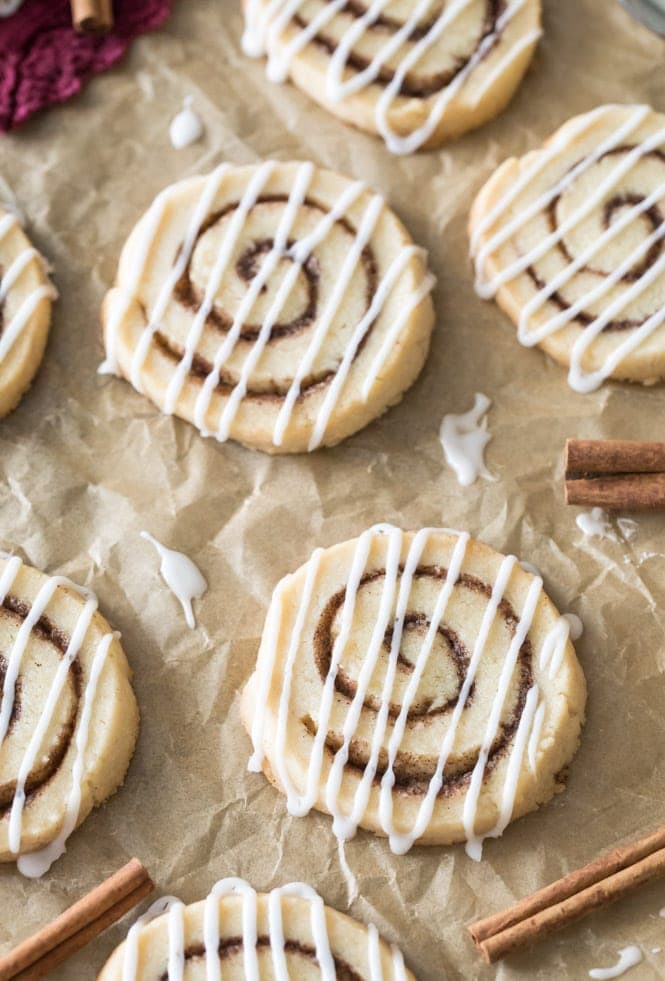 Freshly baked cinnamon roll cookies decorated with white vanilla glaze