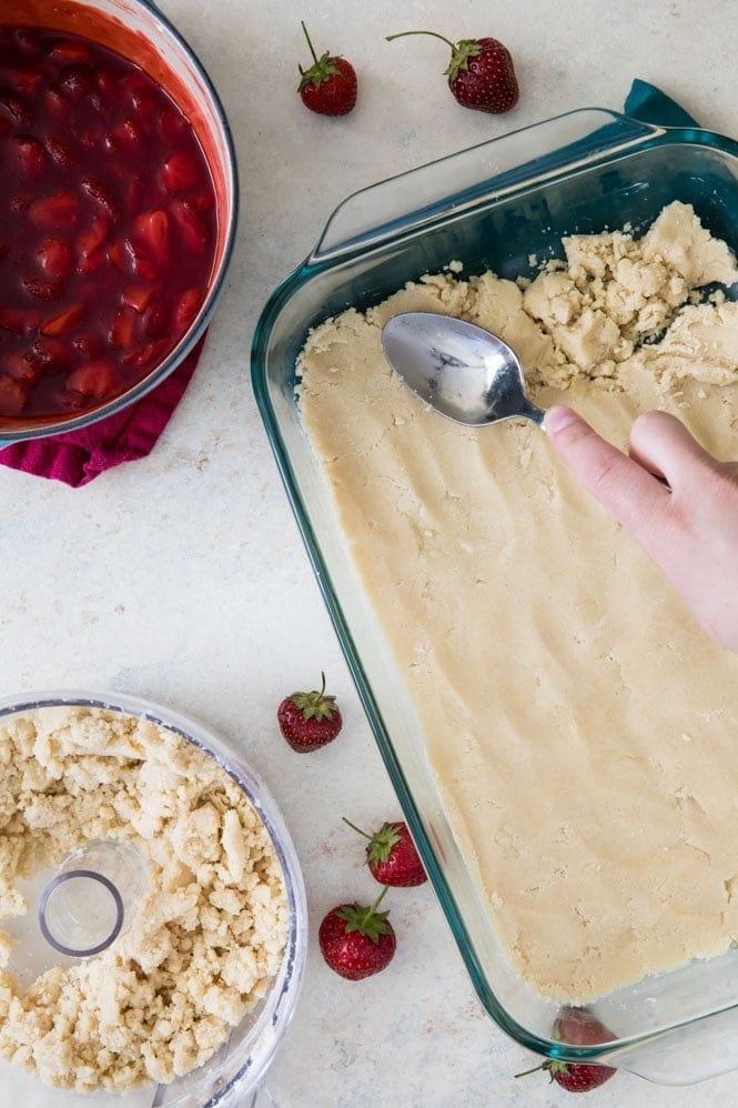 How to make Strawberry Crumb Bars: Pressing crust into pan