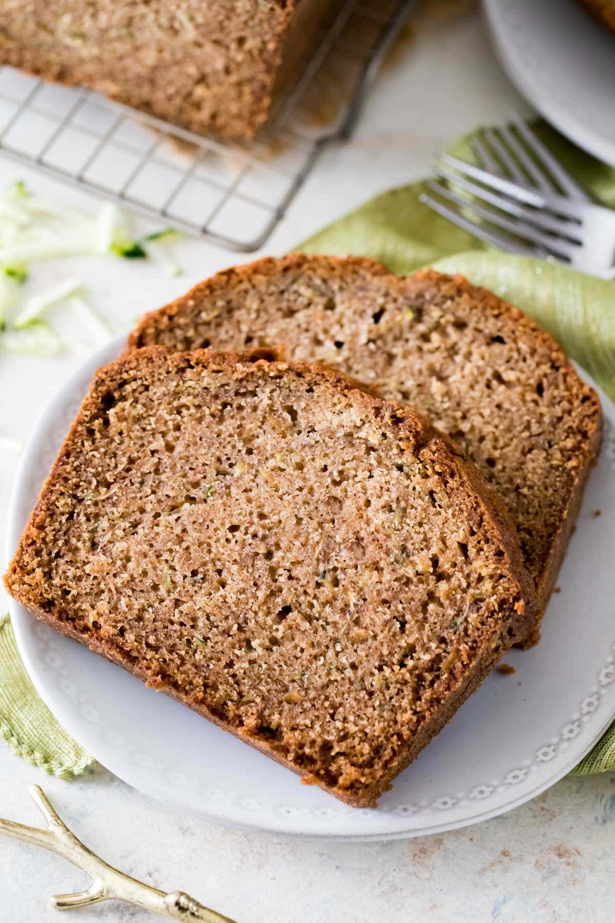 two slices of zucchini bread on white plate