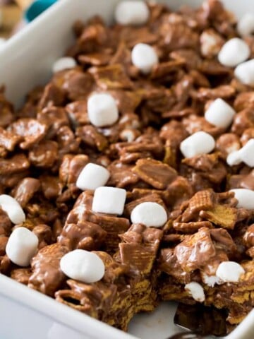 Smores cereal bars in baking dish with portion removed
