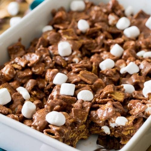Smores cereal bars in baking dish with portion removed