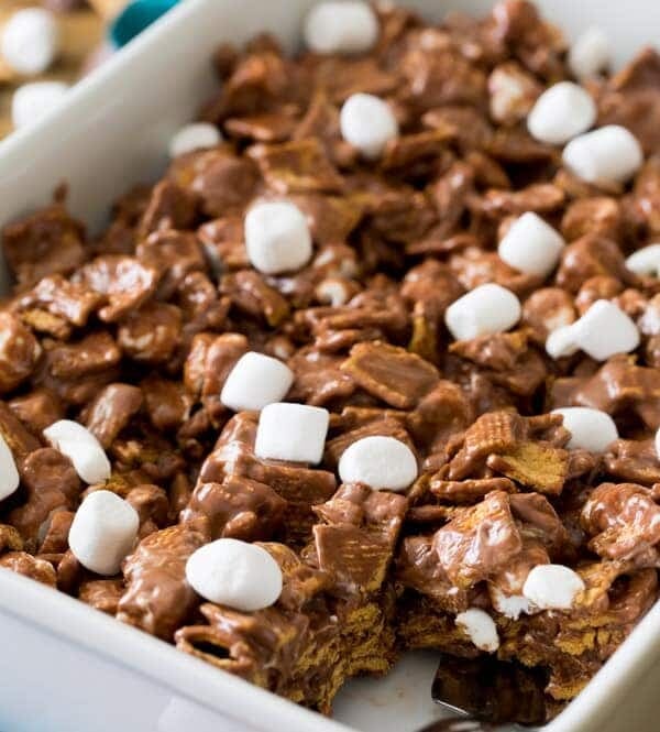 Smores cereal bars in baking dish with portion removed