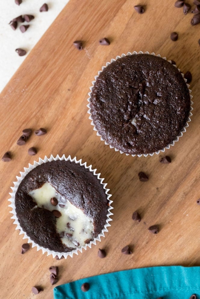 A black bottom cupcake that has been overfilled (top) and a black bottom cupcake that has been filled properly (below)