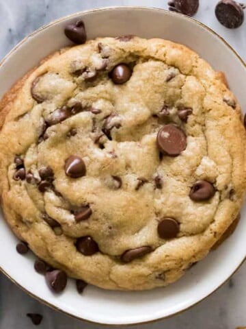 giant chocolate chip cookie in bowl
