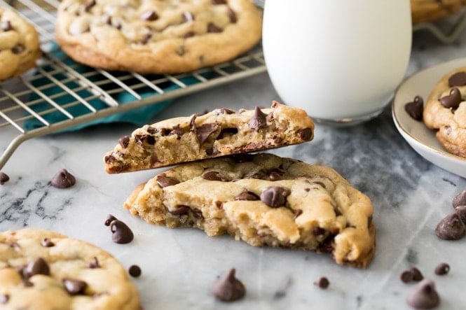 Big chocolate chip cookie broken in half with halves stacked on top of each other