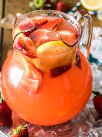 pitcher of strawberry lemonade on ice