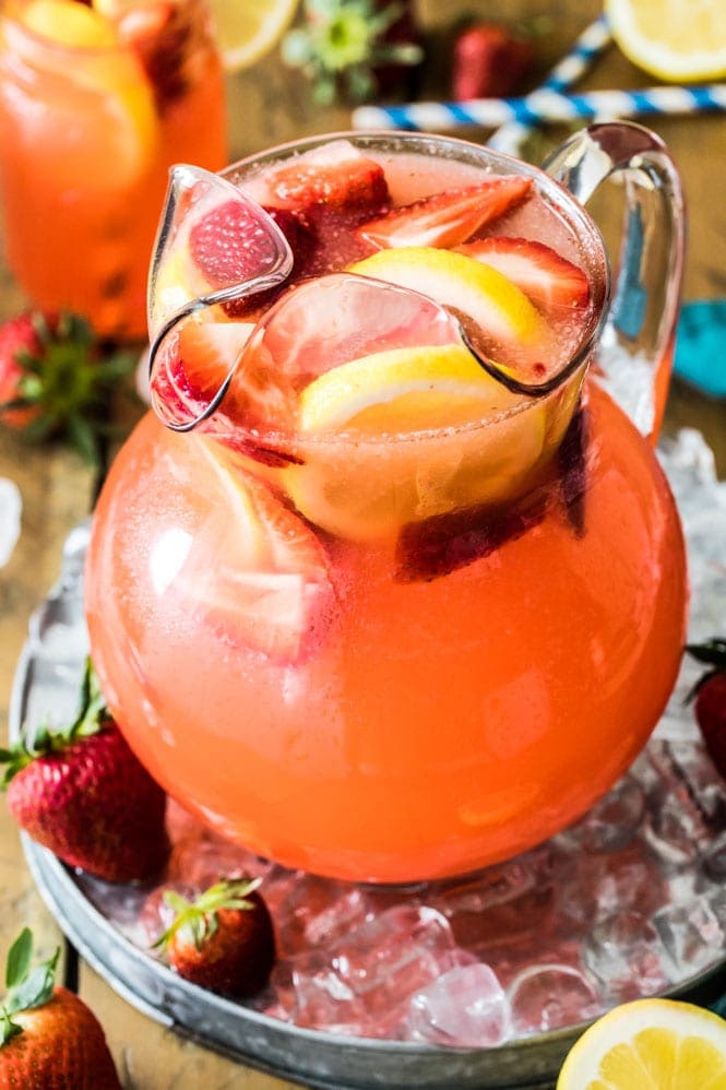 Glass pitcher of strawberry lemonade