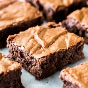 Brownies from scratch, cut into squares on marble with chocolate chips