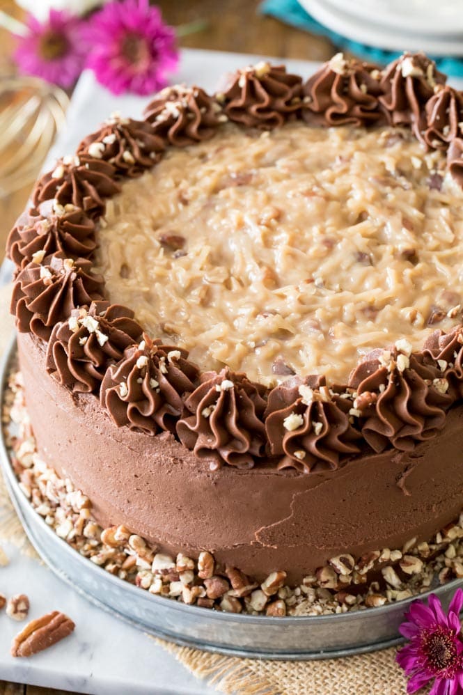 Close-up of whole German Chocolate Cake to show texture of frosting and icing design
