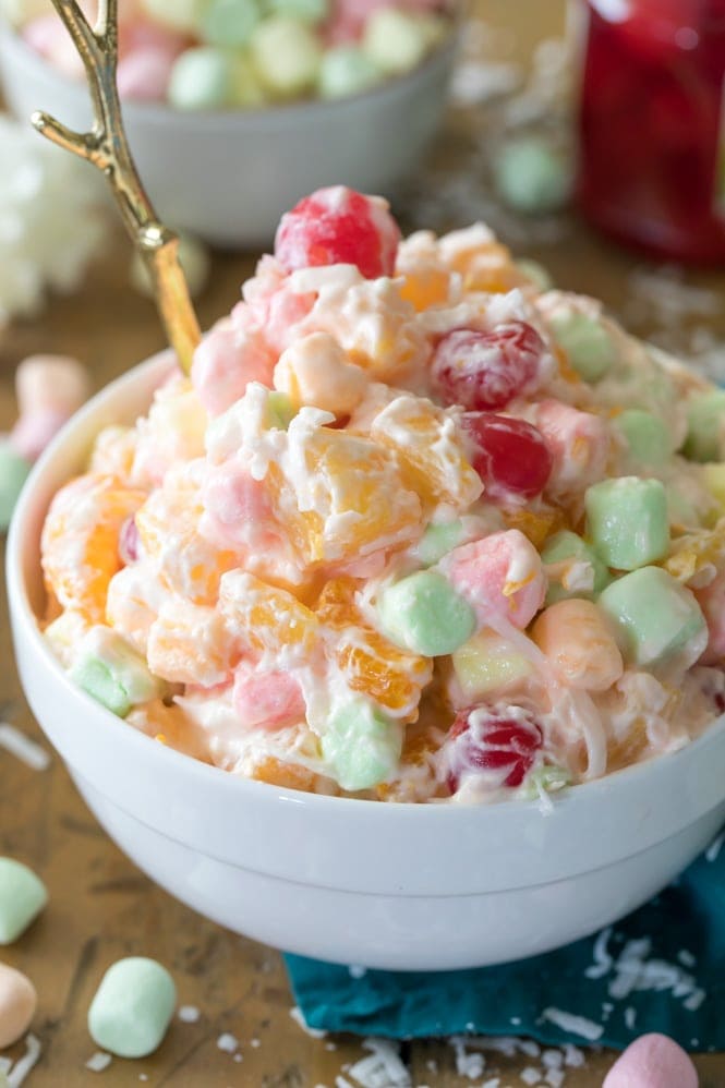 Ambrosia salad in white bowl with spoon