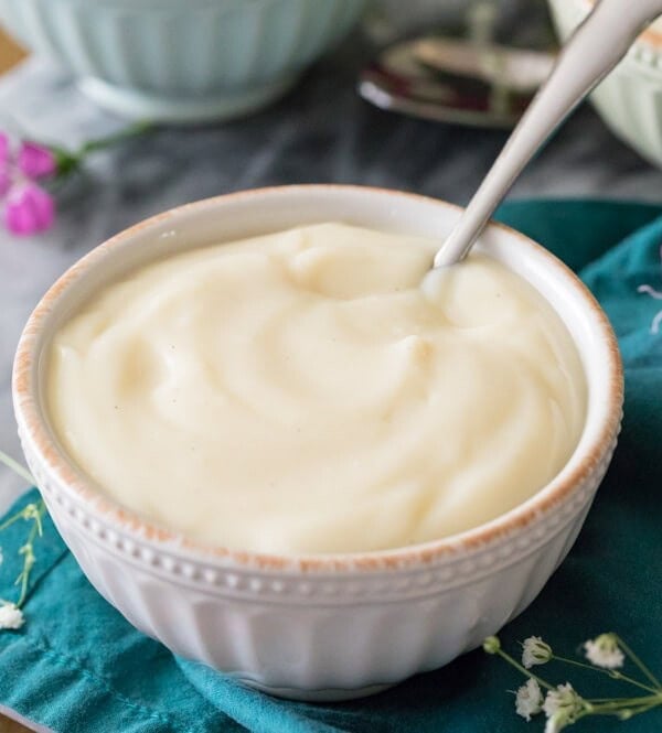 Vanilla pudding in bowl on blue towel