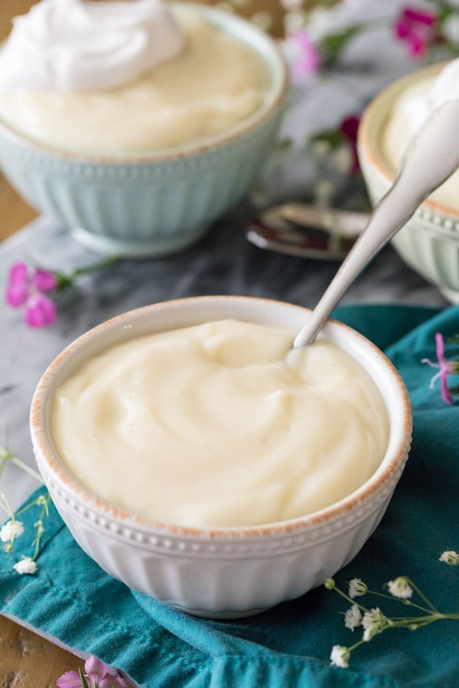 Homemade vanilla pudding in white bowl