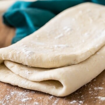 folded puff pastry dough on cutting board