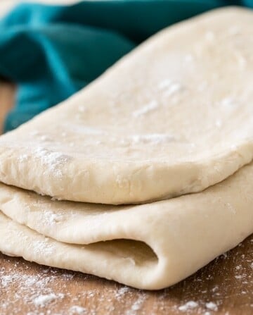 folded puff pastry dough on cutting board
